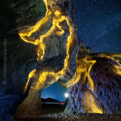 Natural arch in the rock, Cirali beach, Turkey (Türkiye)