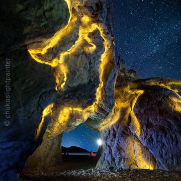 Natural arch in the rock, Cirali beach, Turkey