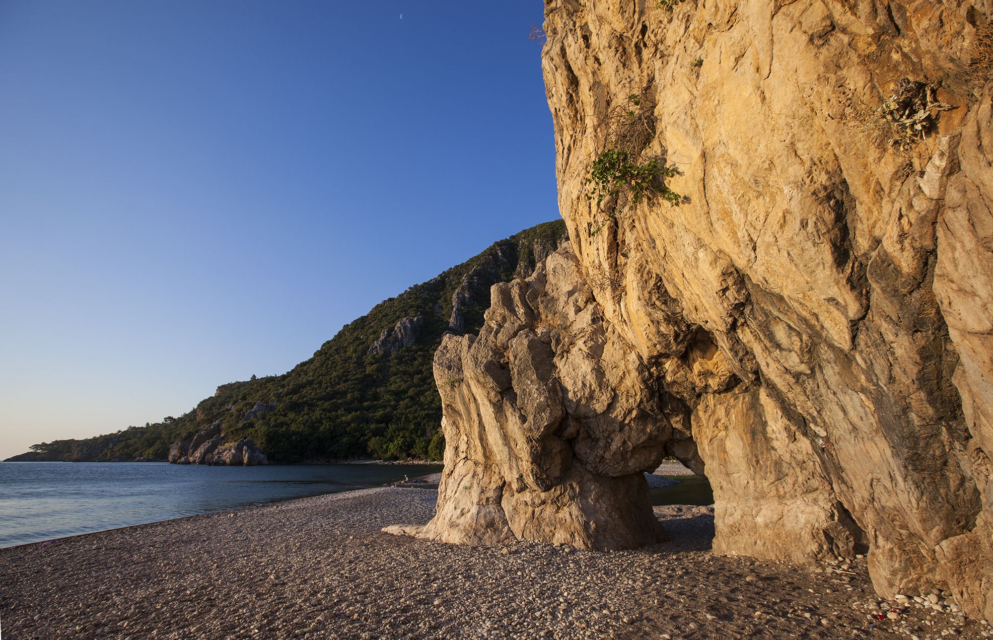 Natural arch in the rock, Cirali beach, Turkey (Türkiye)