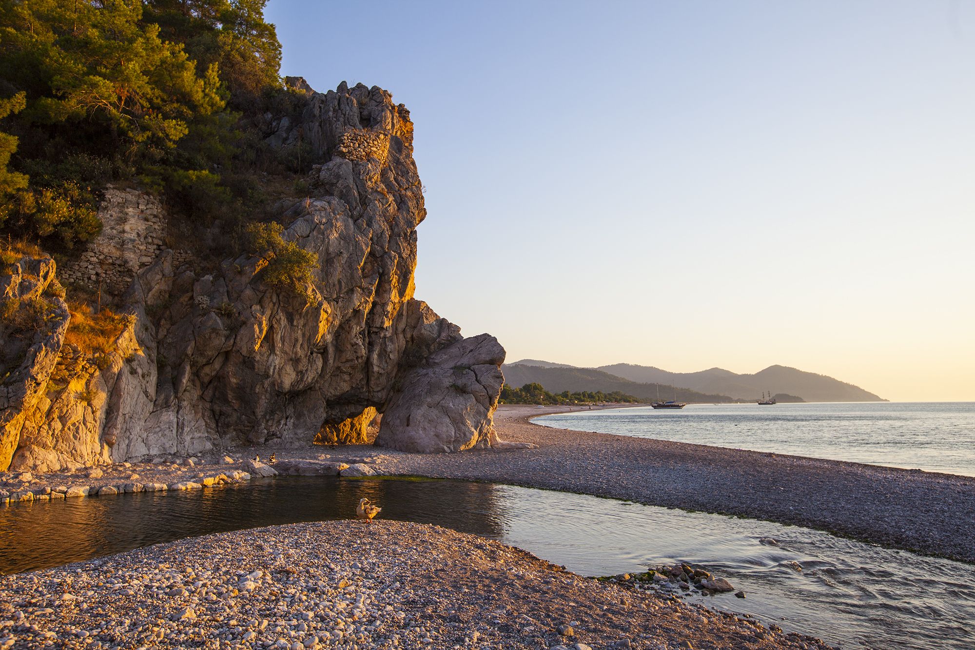 Natural arch in the rock, Cirali beach, Turkey (Türkiye)