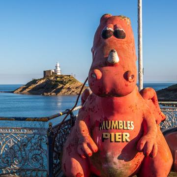 Mumbles pier dragon and lighthouse Wales, United Kingdom