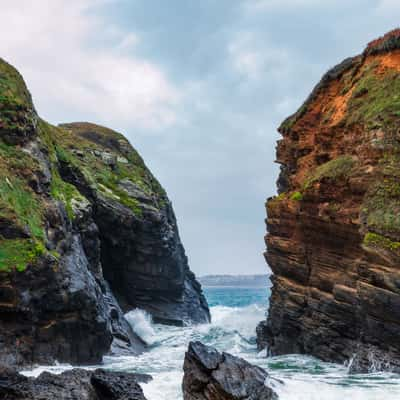 The incoming tide reaches a secluded pebble beach, France