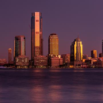 Jersey City reflection sunrise from Lower Manhattan, New York City, USA