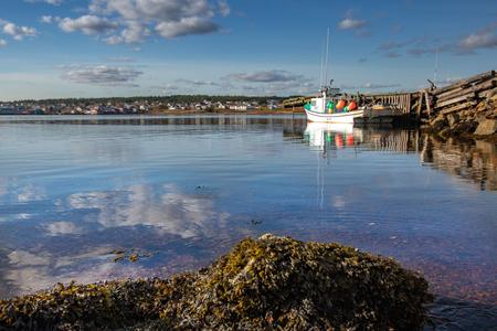 Lone fishing boat Louisbourg Cape Breton Nova Scotia
