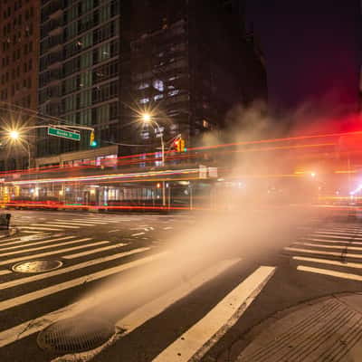 Steam escaping from Manhole covers in Manhattan New York, USA