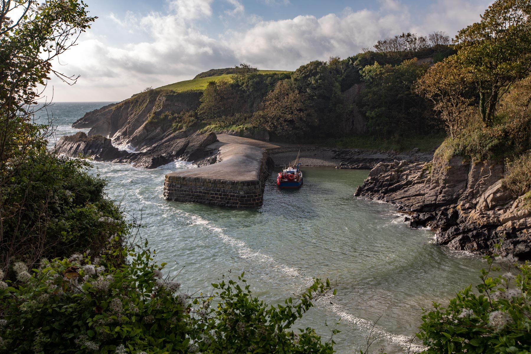 Fishing boat small harbour Stackpole, Wales, United Kingdom
