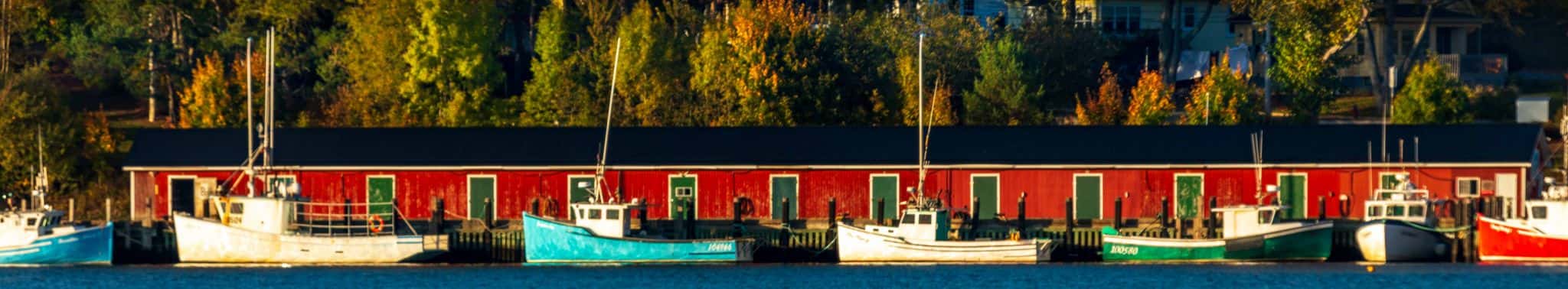 Fishing boats, red fishing sheds, Lunenburg, Nova Scotia