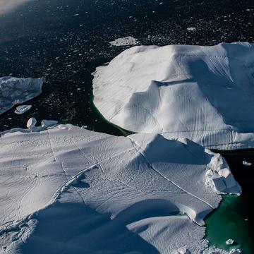 Flying above the iceberg of Sermeq Kujalleq glacier, Greenland