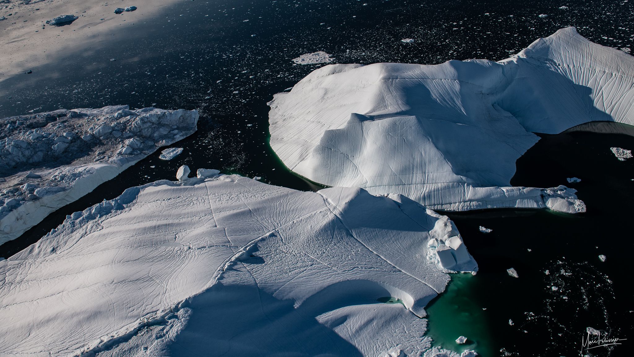 Flying above the iceberg of Sermeq Kujalleq glacier, Greenland
