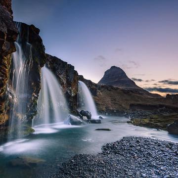 Kirkjufellsfoss waterfall and Kirkjufell mountain in Iceland, Iceland