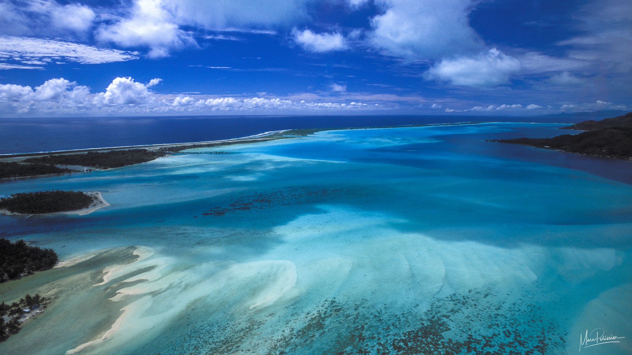 Sand pattern in blue lagoon, French Polynesia