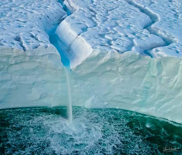 The icy blue waterfall at Austfonna