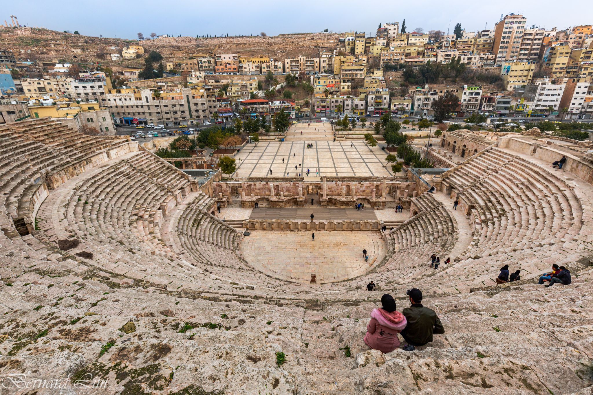 A young couple enjoying the view at the Roman Theatre, Jordan