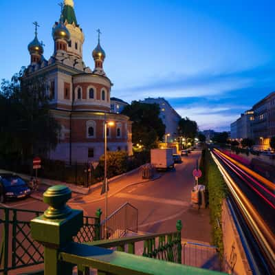 Trains passing the Kathedrale zum heiligen Nikolaus, Austria