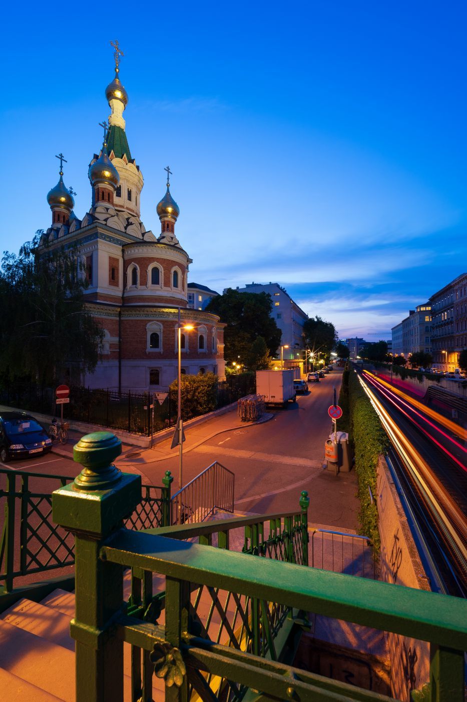 Trains passing the Kathedrale zum heiligen Nikolaus, Austria