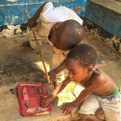 Boys playing 'Pool' Senga, Malawi