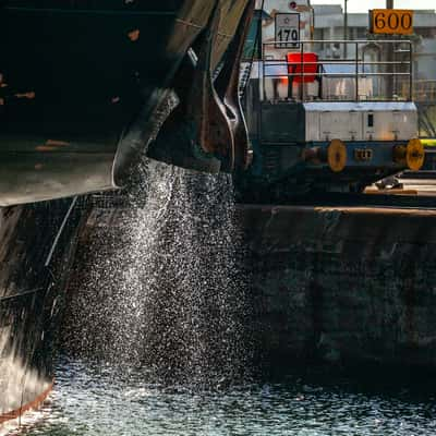 Ship discharing water and the tow train Panama Canal, Panama