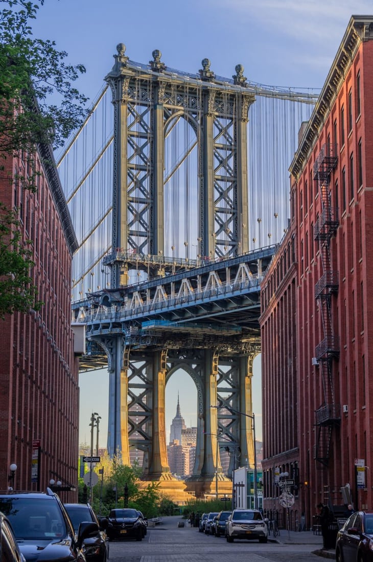 Empire State Building framed by Manhattan Bridge, USA