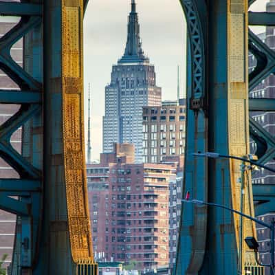 Empire State Building framed by Manhattan Bridge, New York City, USA