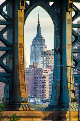 Empire State Building framed by Manhattan Bridge, New York City
