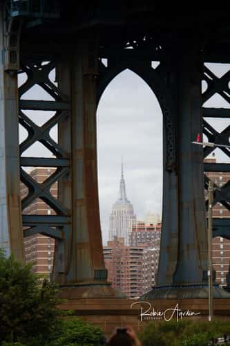 Empire State Building framed by Manhattan Bridge, New York City