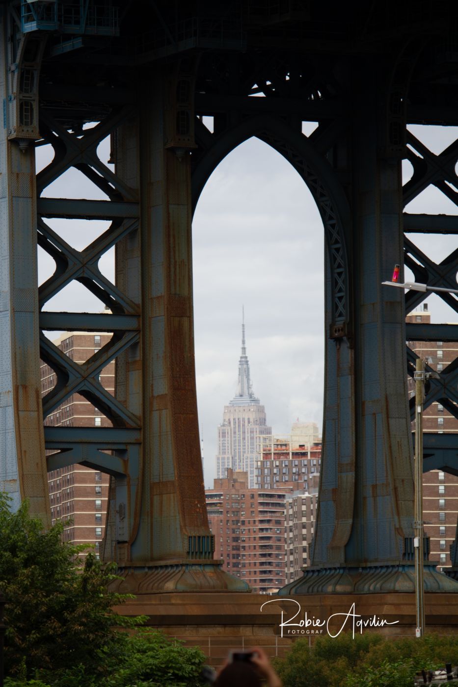 Empire State Building framed by Manhattan Bridge, New York City, USA