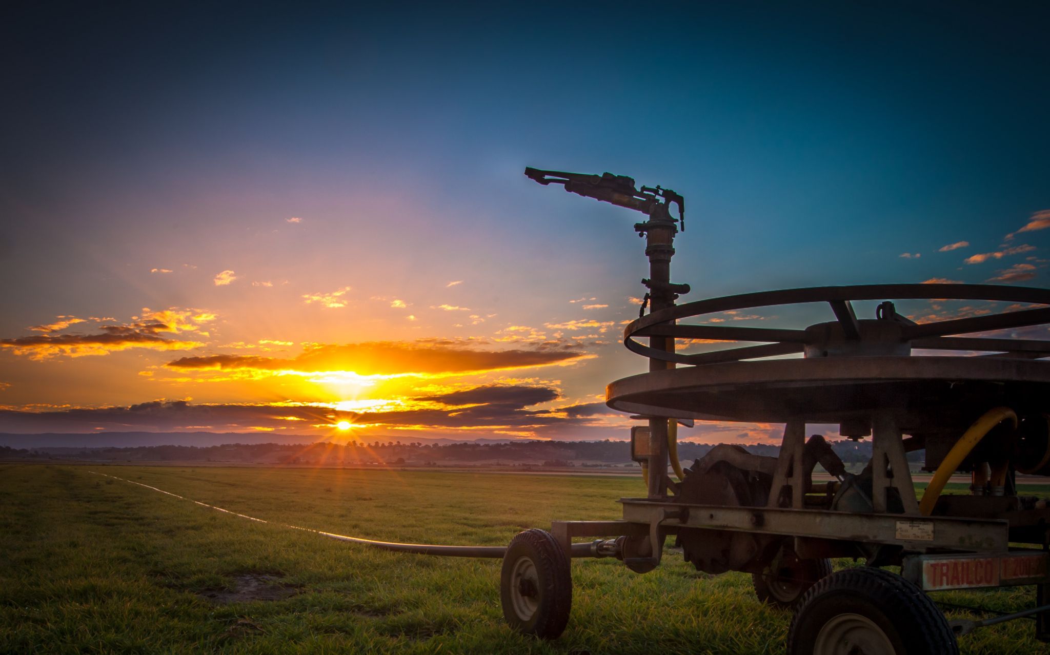 Water irrigator sunset Freeman's Reach, Windsor, Australia