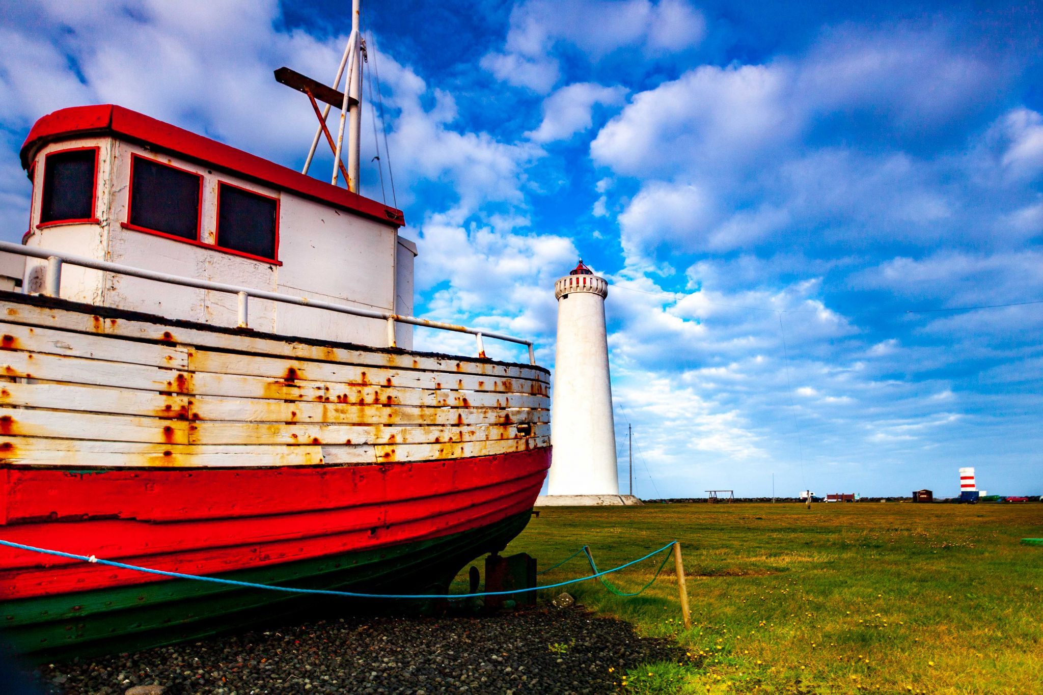 Lighthouse and Fishing Boat Gardur, Iceland