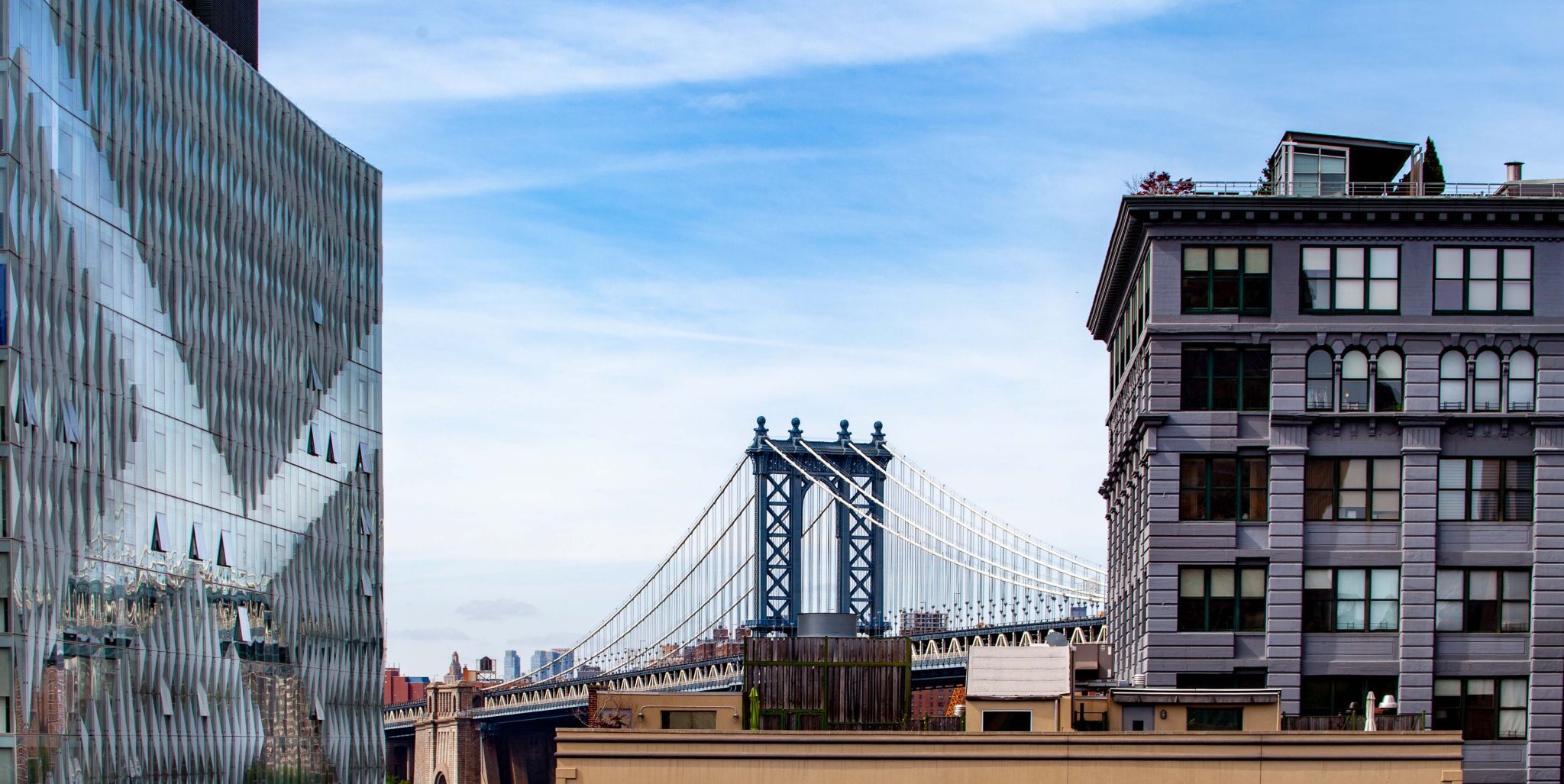 Manhattan Bridge through the buildings Brooklyn, USA