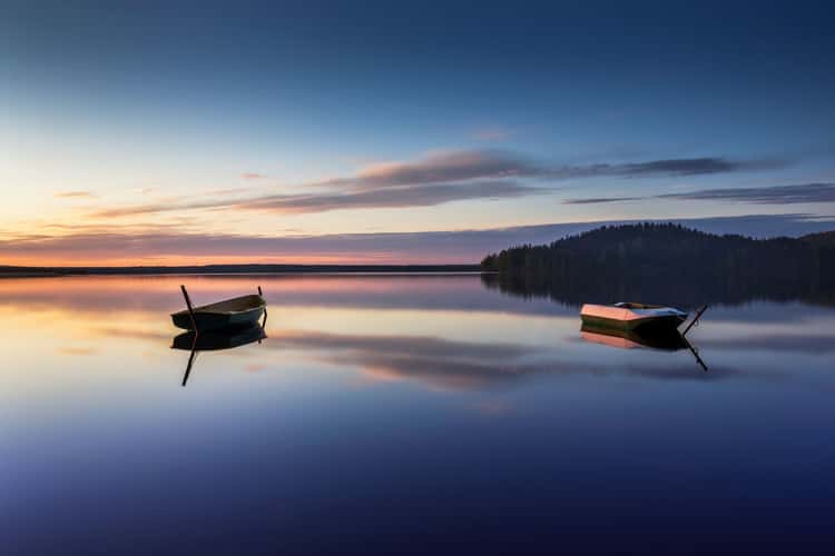 Parking for small fishing boats on the lake during sunset