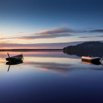Parking for small fishing boats on the lake during sunset, Russian Federation