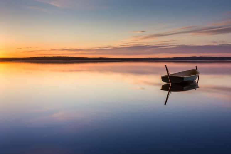 Parking for small fishing boats on the lake during sunset