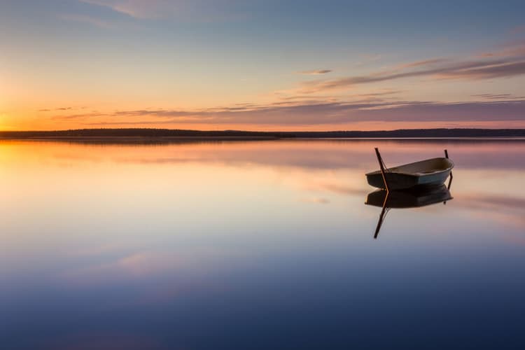 Parking for small fishing boats on the lake during sunset