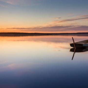 Parking for small fishing boats on the lake during sunset, Russian Federation