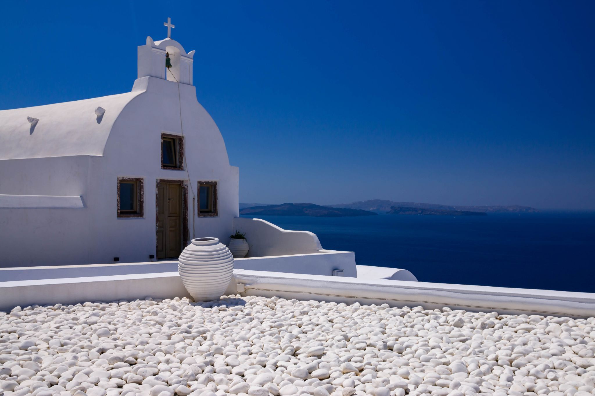 Withe chapel in IO Santorini, Greece