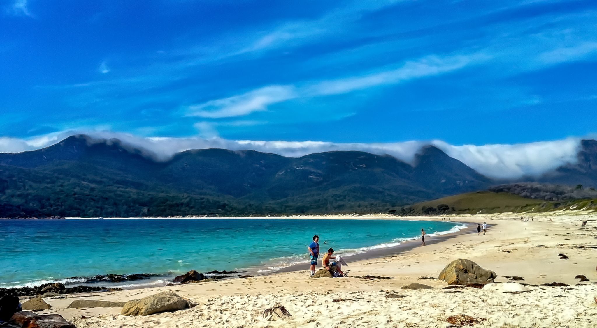Wine Glass bay clouds on mountains Tasmania, Australia
