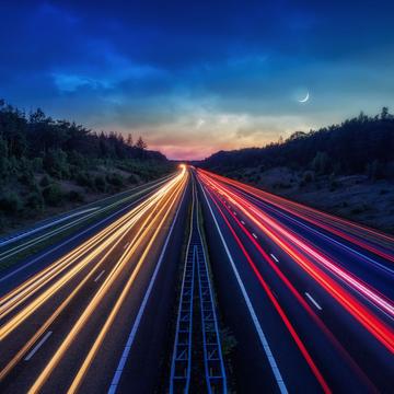 A1 motorway near Apeldoorn with Traffic and Moon., Netherlands