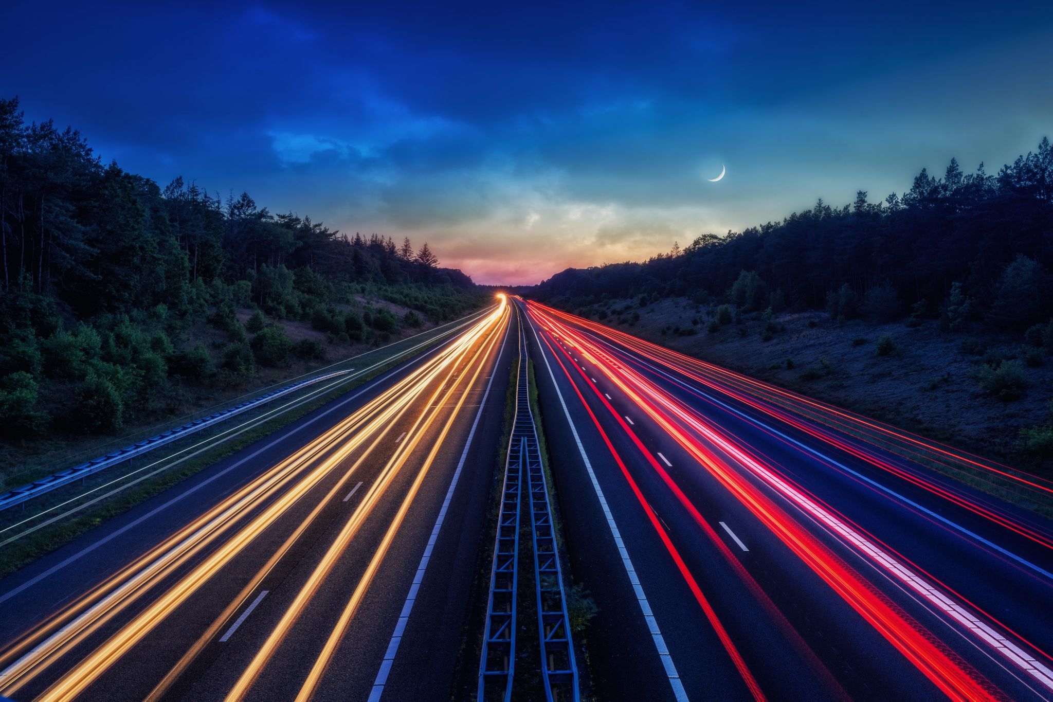 A1 motorway near Apeldoorn with Traffic and Moon., Netherlands