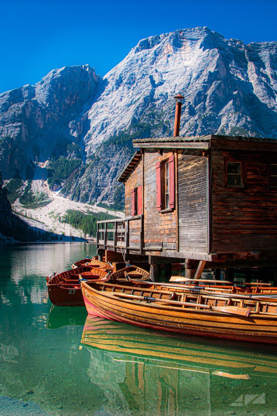 Wooden house on Lago Braies in Dolomites, Italy