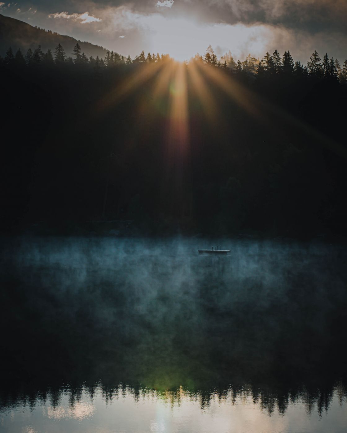 Reflection of the sunrise captured at Caumasee, Switzerland