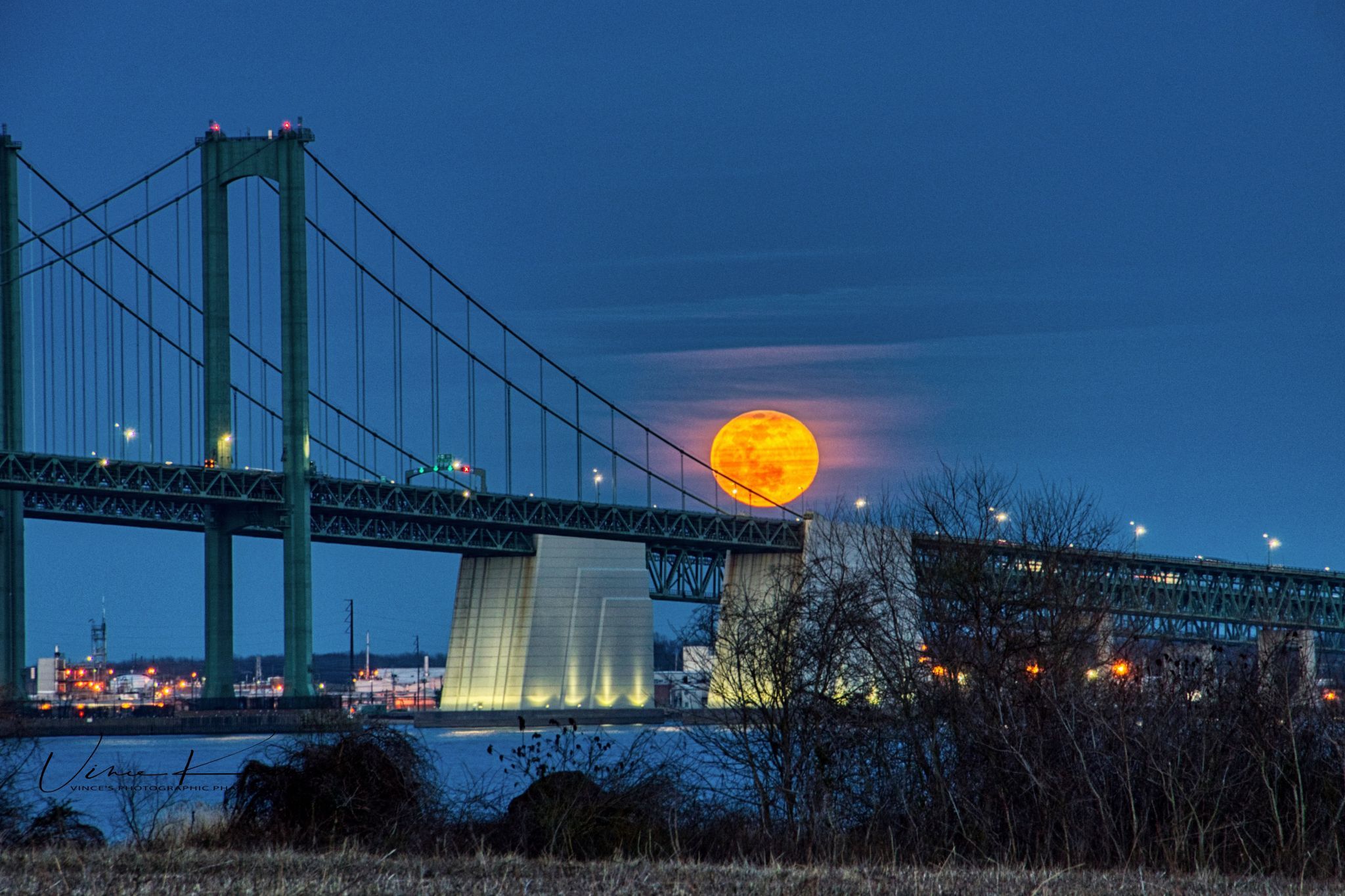 Delaware Memorial Bridge from Delaware River shoreline, USA