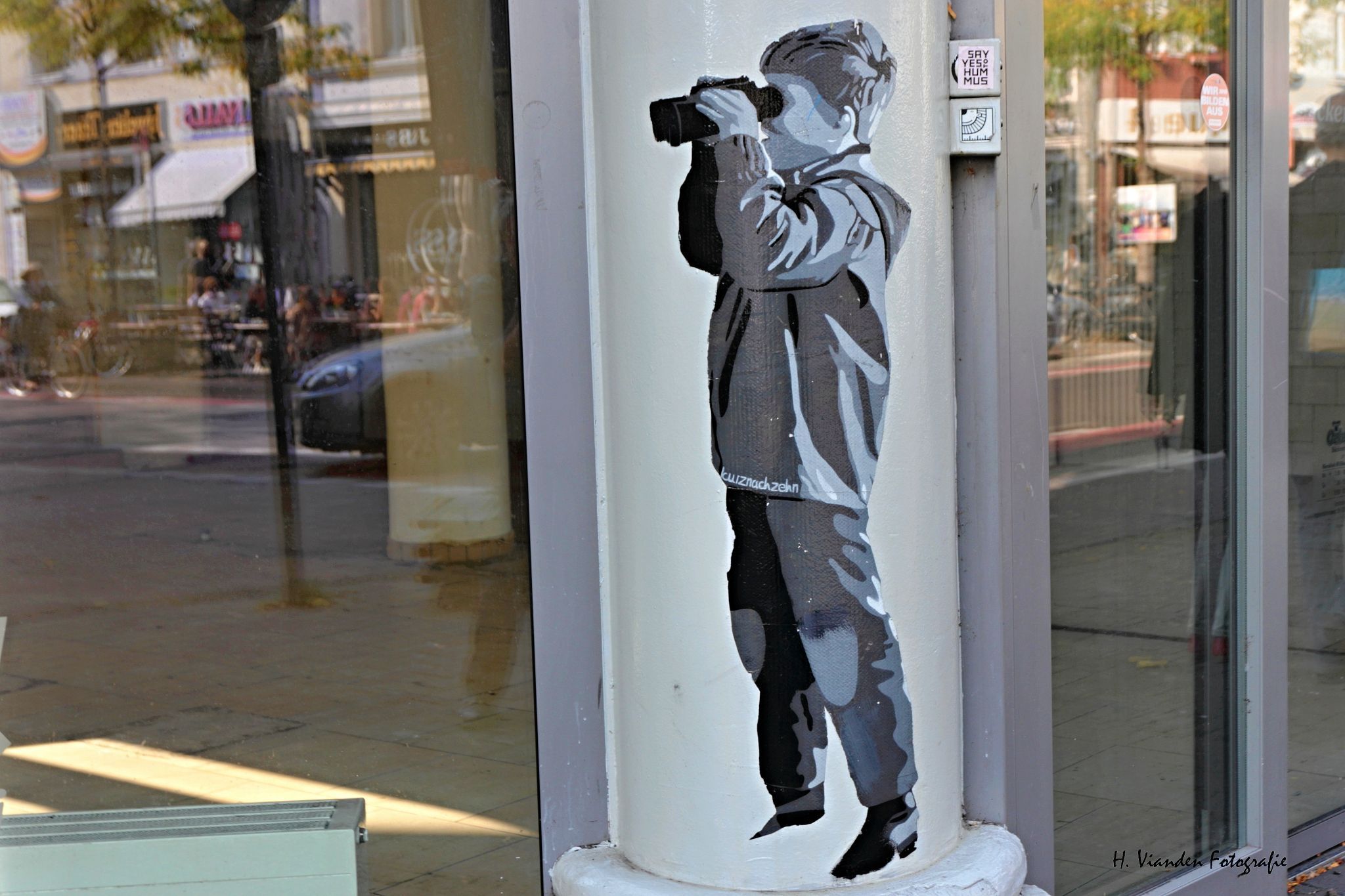 Boy on the lookout with binoculars, Cologne, Germany