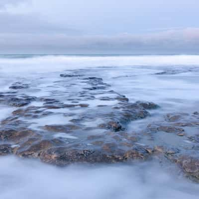 Beach with rocks early in the morning at Ambleteuse, France