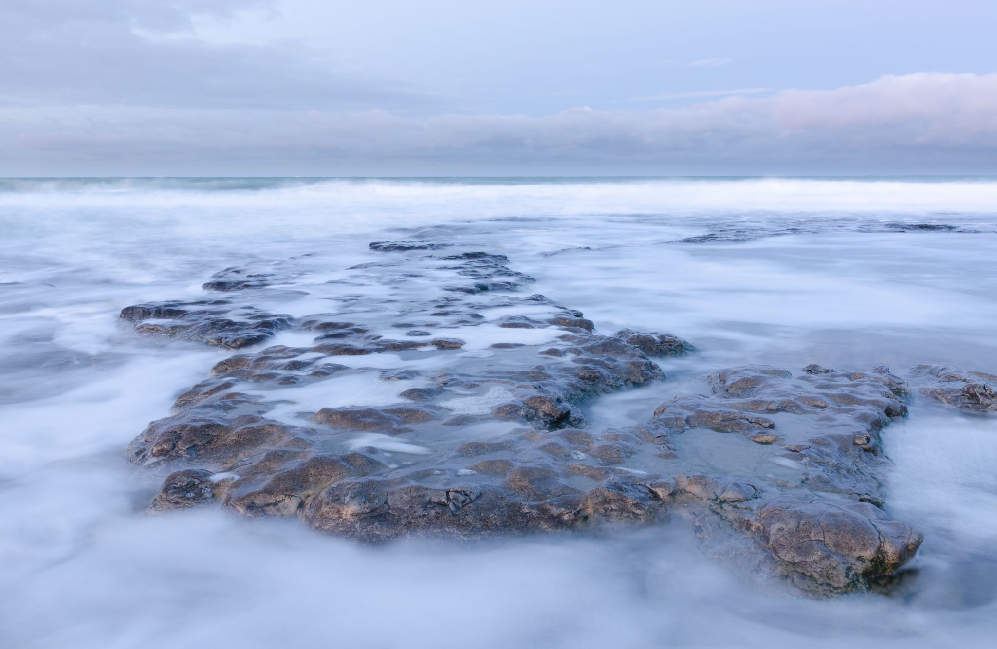 Beach with rocks early in the morning at Ambleteuse, France