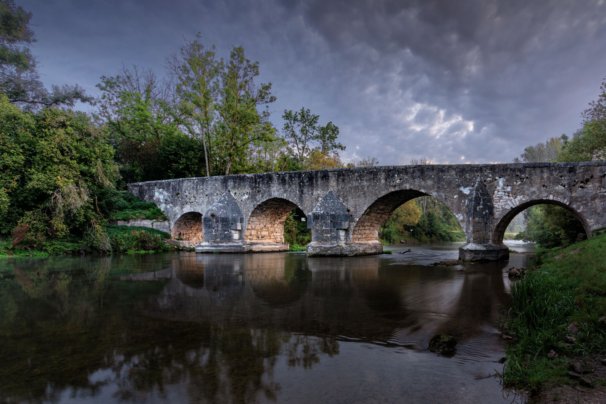 Ancient stone bridge over the Altmuehl River at Pfuenz, Germany