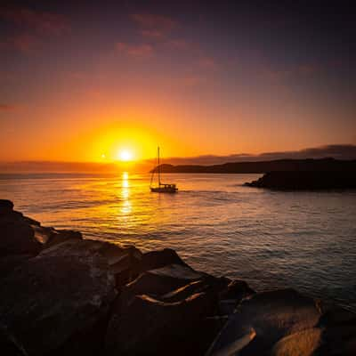 Boat leaving the breakwater, North Haven New South Wales, Australia