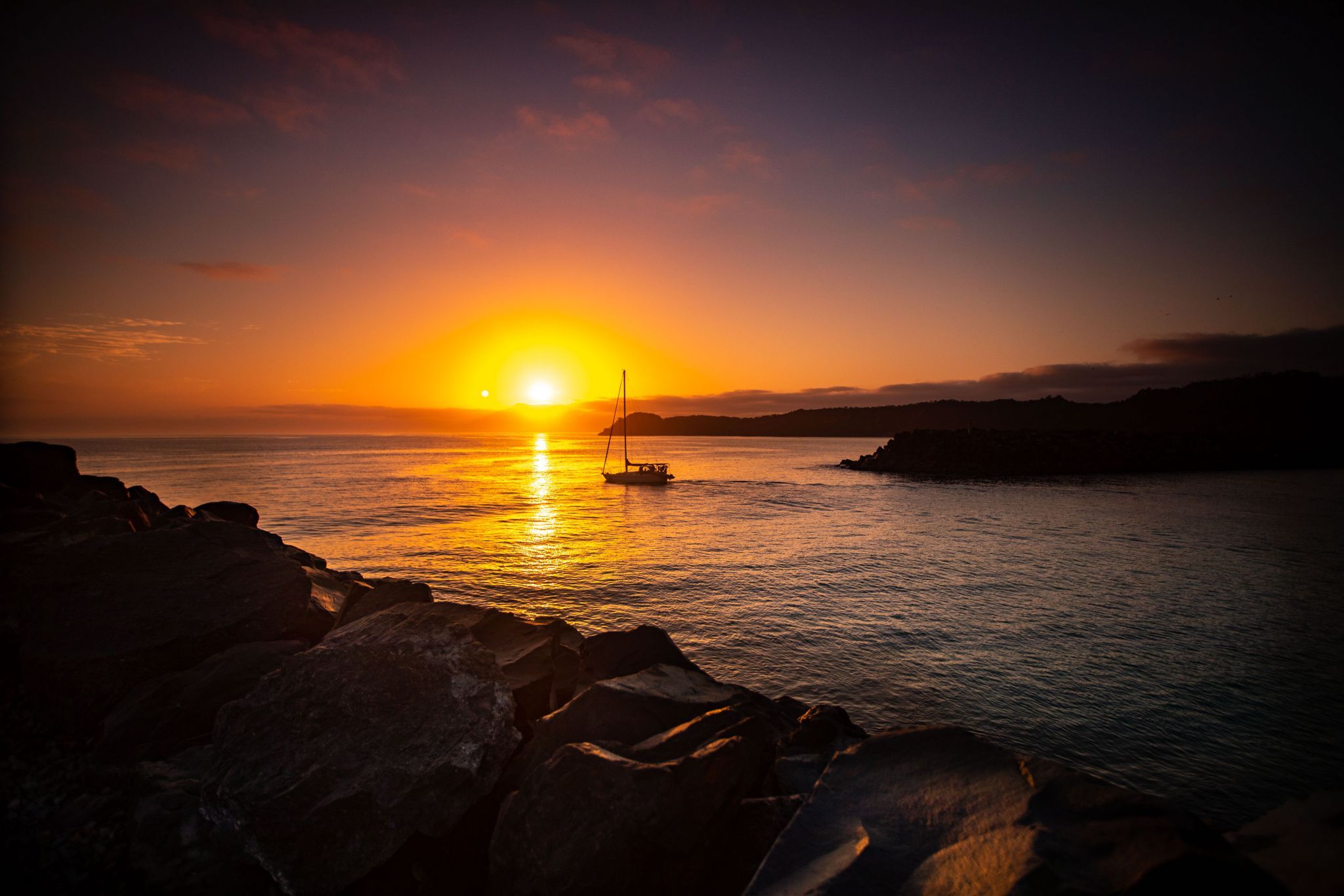 Boat leaving the breakwater, North Haven New South Wales, Australia