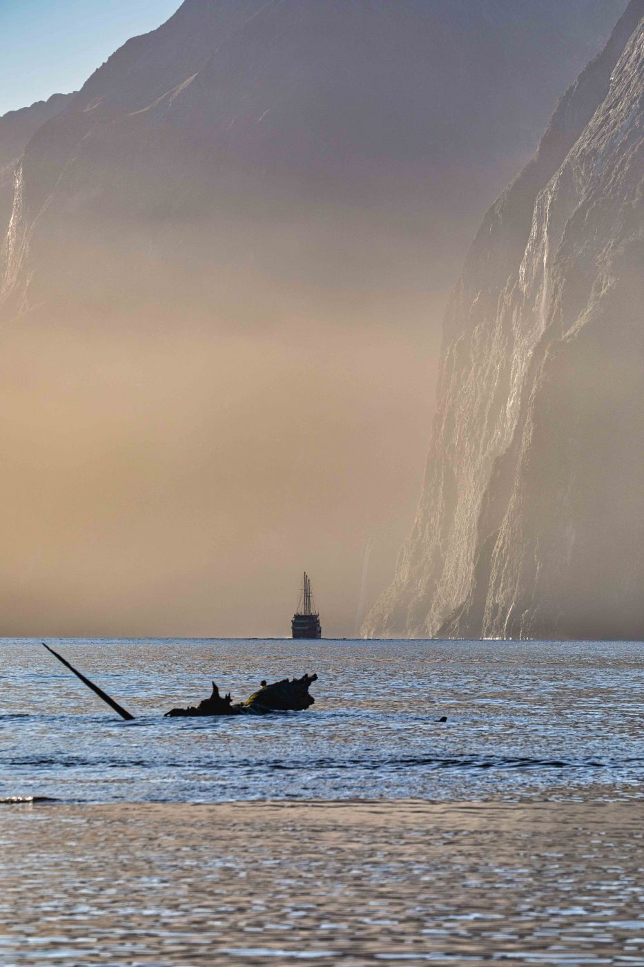 Fog and sailing ship Milford Sound South Island, New Zealand
