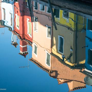 Water reflection in Burano, Italy