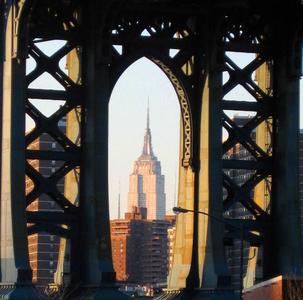 Empire State Building framed by Manhattan Bridge